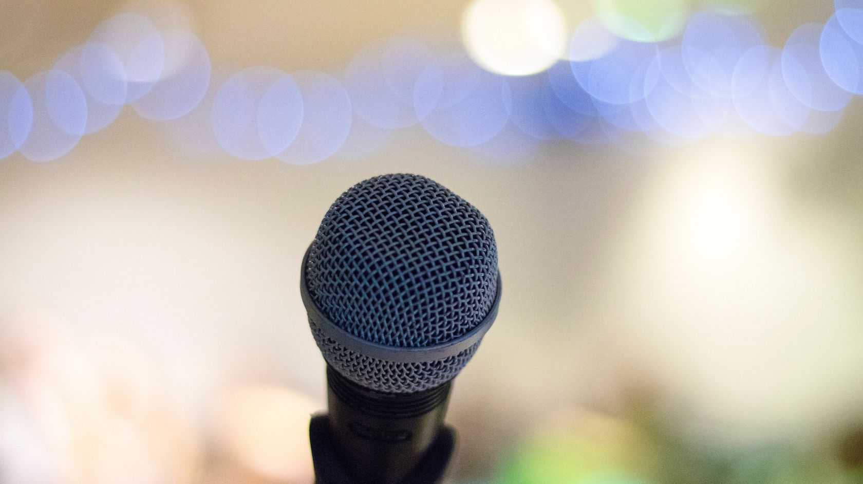 Microphone with fuzzy twinkling lights background